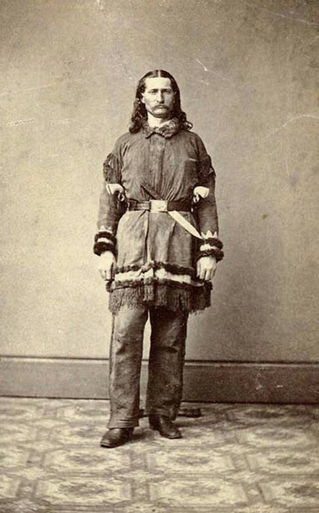 #10 Wild Bill Hickok in 1869. The unsheathed knife is likely a photographer’s prop.