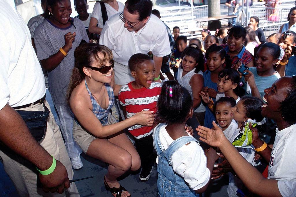 #51 Mariah Carey with children, 1993.