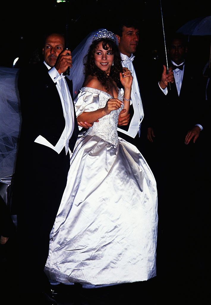 #53 Mariah Carey with her husband Tommy Mottola on her wedding day, 1993.