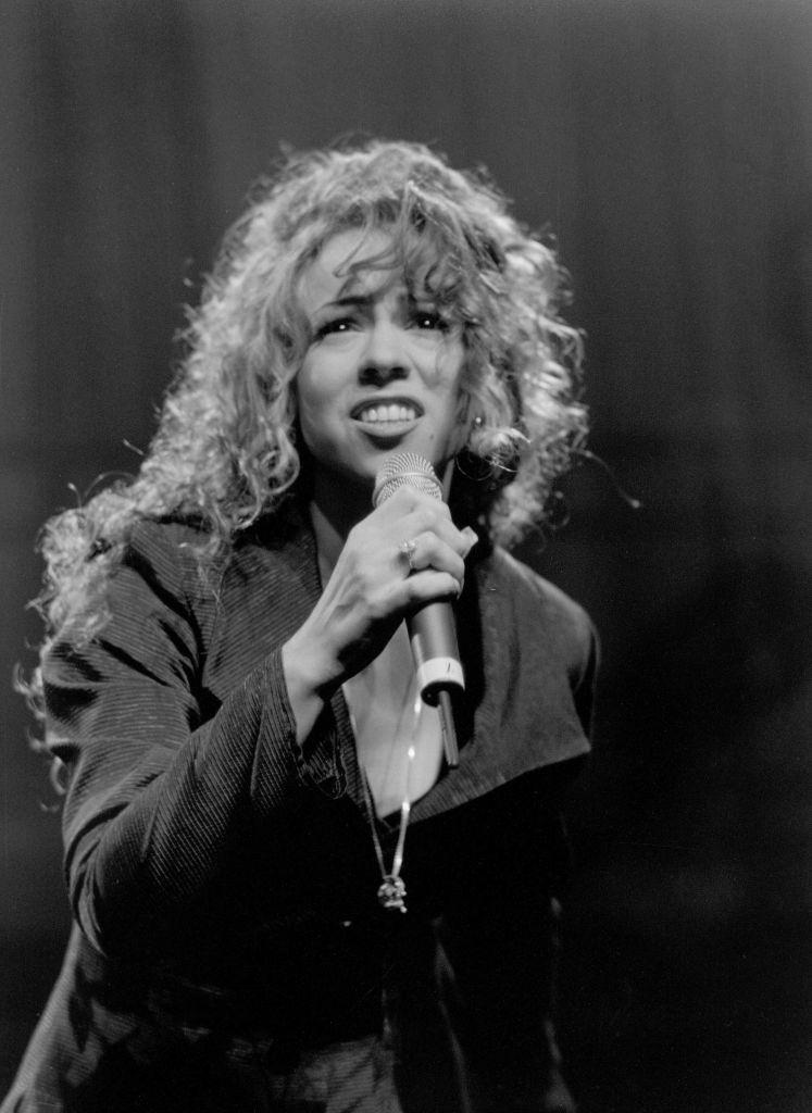 #5 Mariah Carey performing on the stage, 1980s.