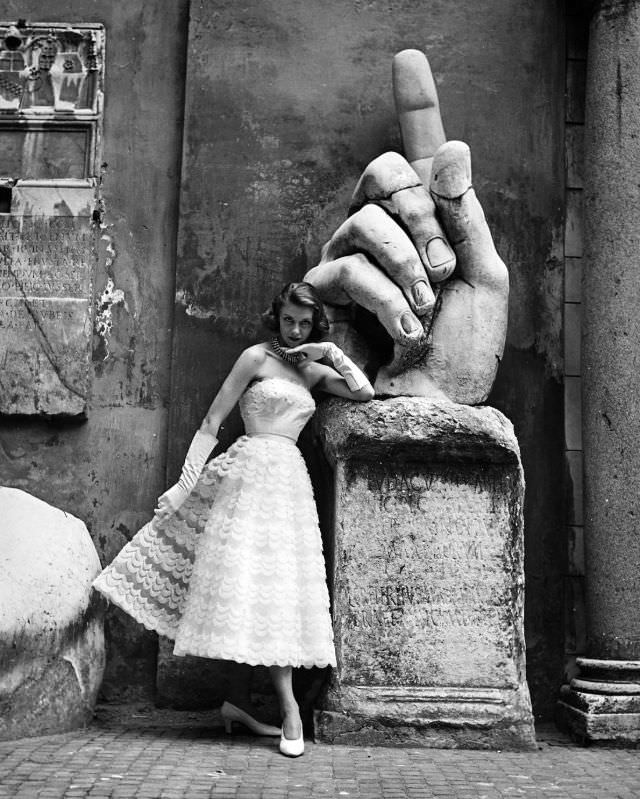 #19 Model is wearing a strapless lace cocktail dress by the Fontana Sisters, photo by Regina Relang, Rome, 1952