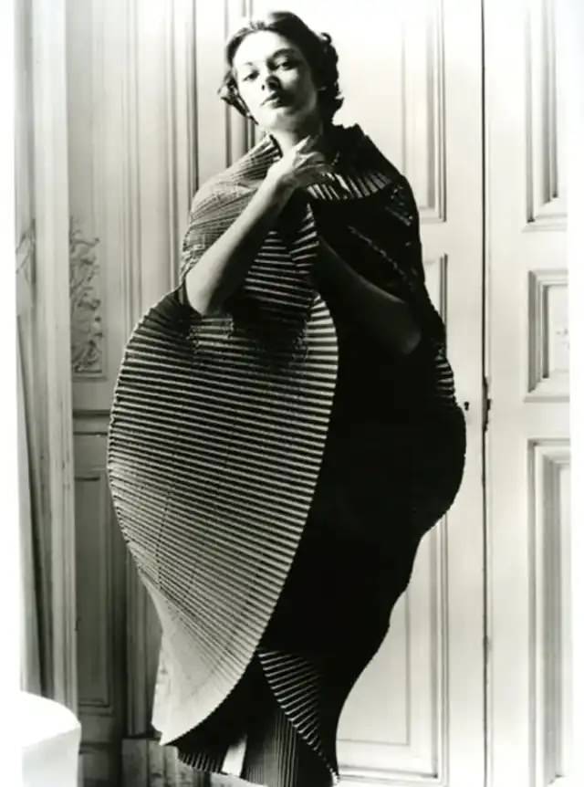 #6 Jacqueline Marsel in finely plisséd dress opened into a cocoon, by Elsa Schiaparelli, photo by Regina Relang, Paris, 1951