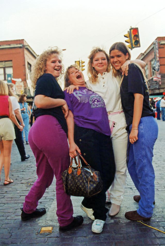 #12 Four teenage girls pose on Exchange Avenue during the festival., Ft. Worth Stockyards, June 1993