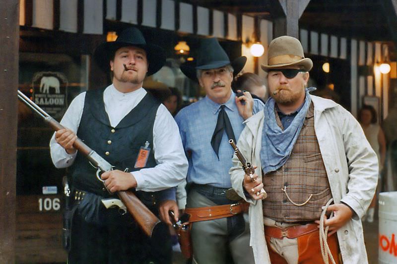 #24 Three Western gunfighters pose by the White Elephant Saloon in the Ft. Worth Stockyards during a festival, likely Chisholm Trails Days, June 1994