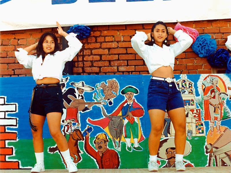 #31 Two pretty Hispanic girls perform a dance at a festival at the Fort Worth Stockyards, June 1995