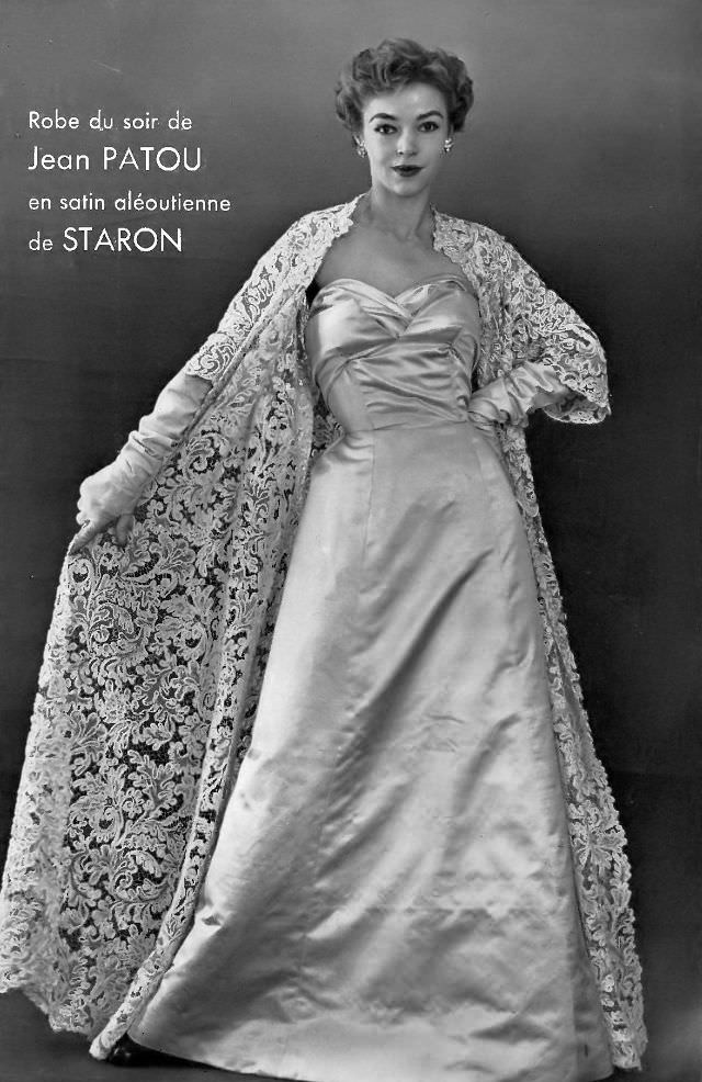 #24 Joan Olson in satin evening gown worn with beautiful full-length lace coat, by Jean Patou, 1954