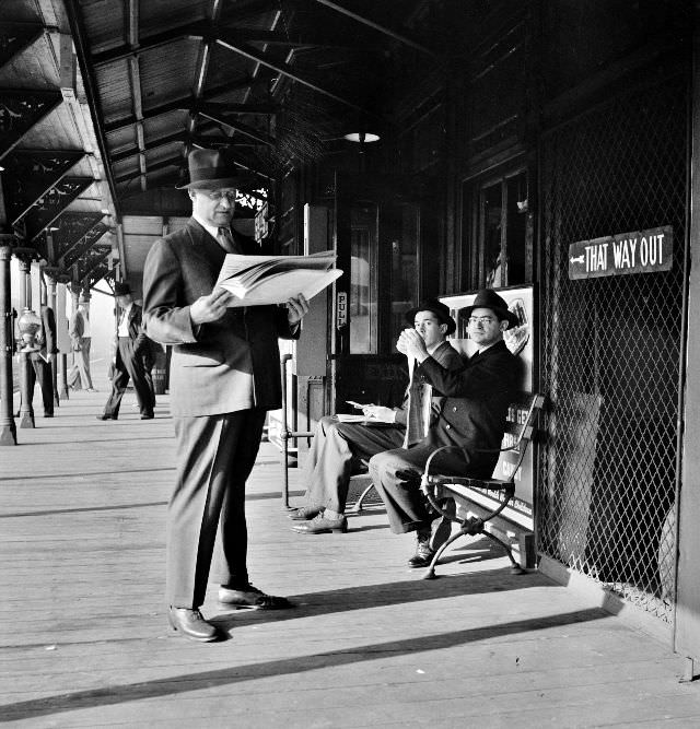#14 Men waiting for the Third Avenue elevated train in the Fifties at 8-30 a.m., New York, New York, September 1942