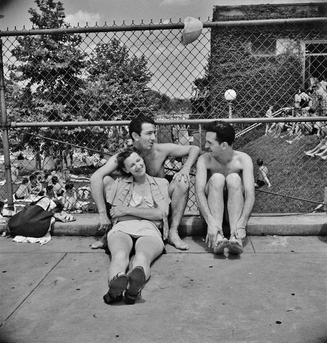 #22 Relaxing on the edge of the municipal swimming pool on Sunday, Washington, D.C., July 1942