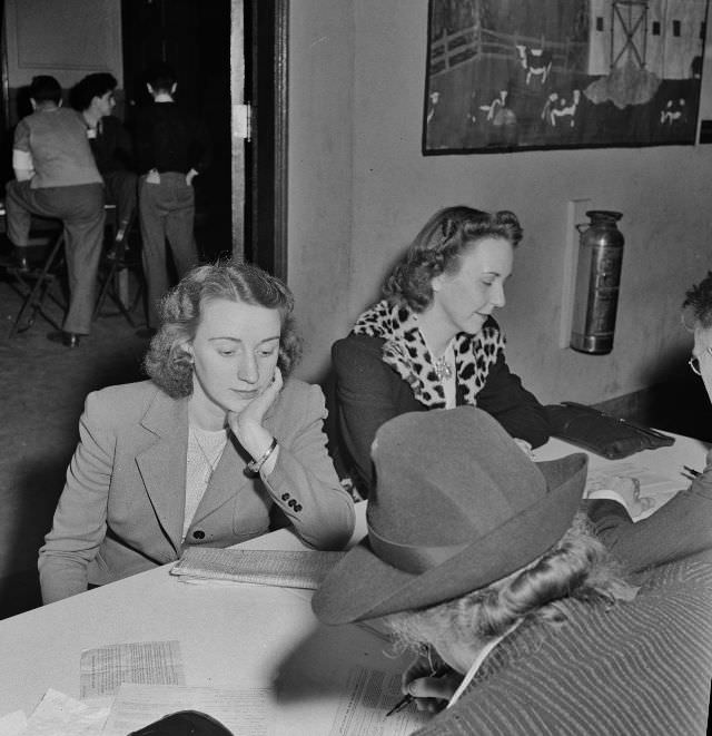 #23 Residents of one of Washington DC’s best residential sections apply for sugar ration cards at Adams School, May 1942