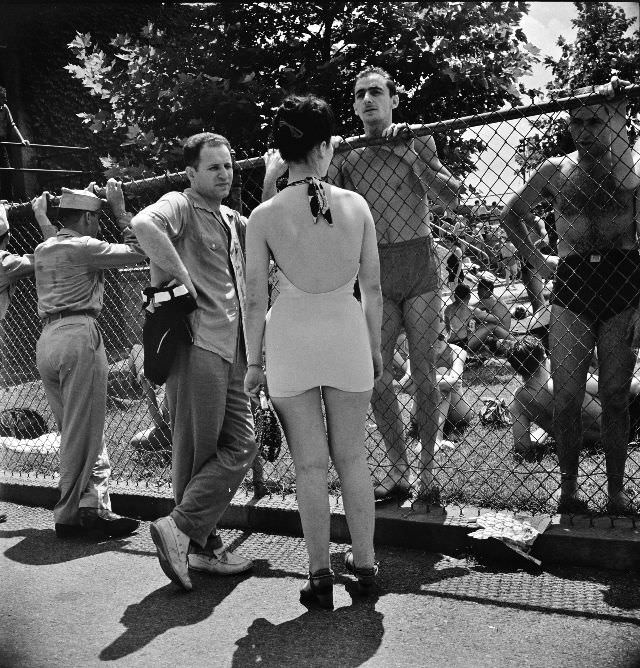 #28 Sunday crowds are so great at the municipal swimming pool that long lines form awaiting their turn, Washington, D.C., July 1942