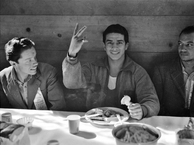 #44 Mexican agricultural laborers who have come to help harvest beets eating their lunch, Stockton, California, May 1943