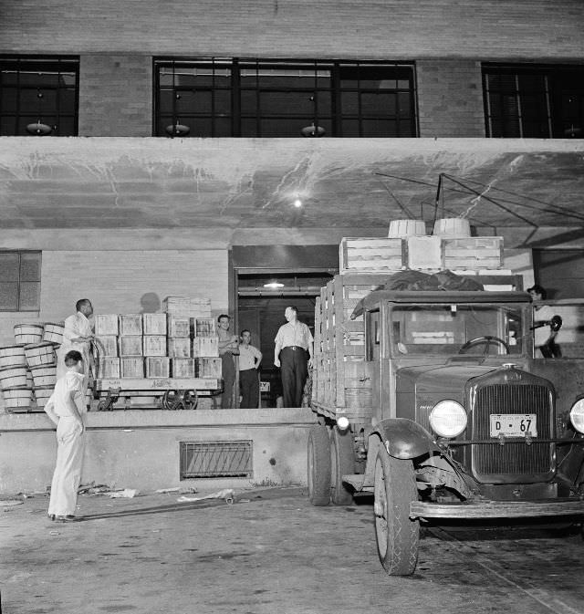 #8 District grocery store warehouse on 4th Street S.W. Farmers bringing their produce in trucks, between two and five a.m., Washington, D.C., July 1942