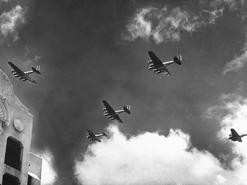 #3 B-17 Bomber planes soaring through the sky, December 1941.