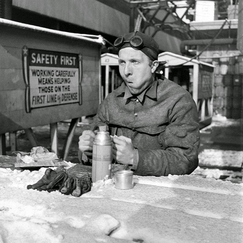#8 A worker on break at the Brooklyn Navy Yard, 1941.