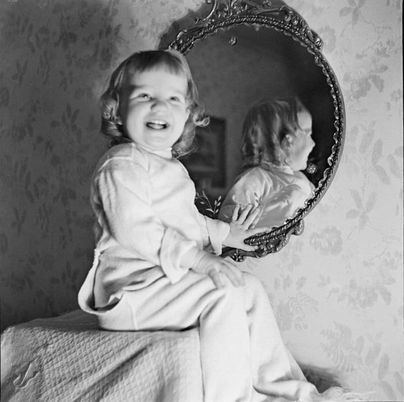 #13 Betty Leah poses for a portrait photo in front of a mirror