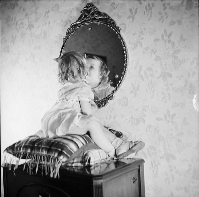 #19 Betty Leah poses for a portrait photo while looking in a mirror