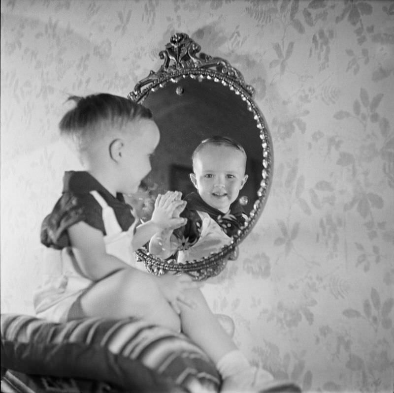 #23 Lee Wallace Coleman looking into a mirror