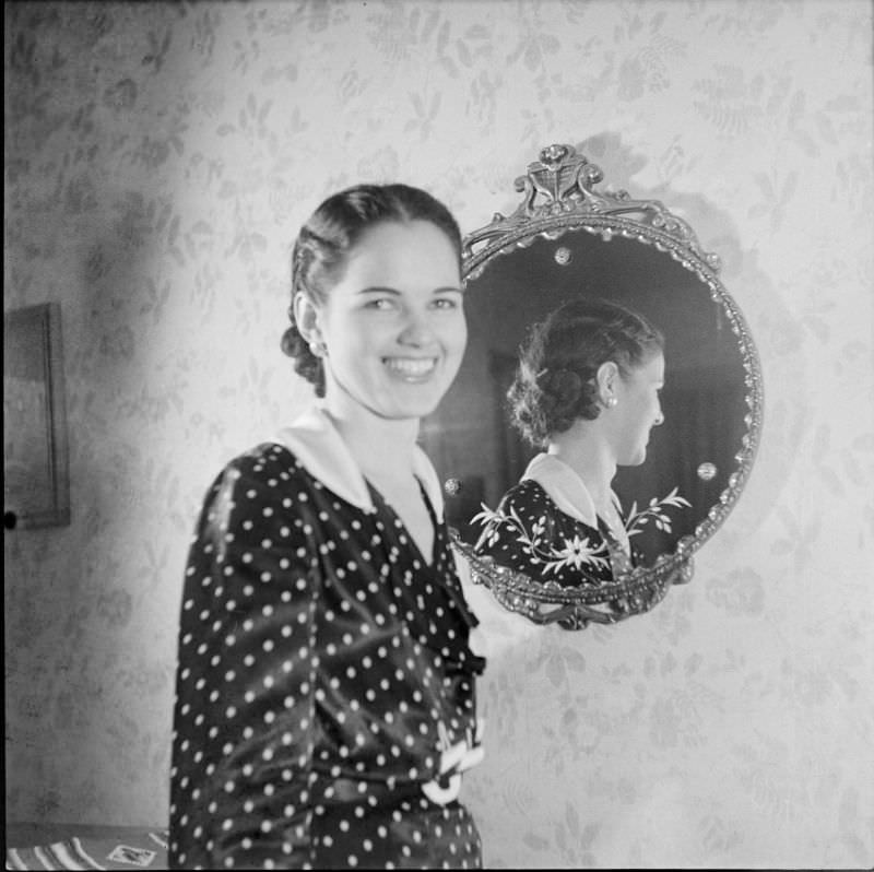 #9 A woman standing in front of a mirror