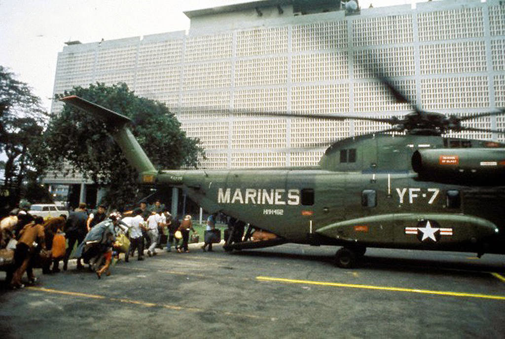 #35 Civilian evacuees board US Marine helicopter inside US Embassy compound to be helilifted to the US Seventh Fleet ahead of Communist troops about to enter Saigon.