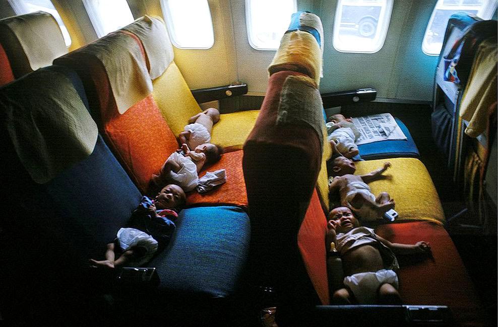 #16 South Vietnamese babies on a flight from Saigon to the USA (probably San Francisco) during Operation Babylift.