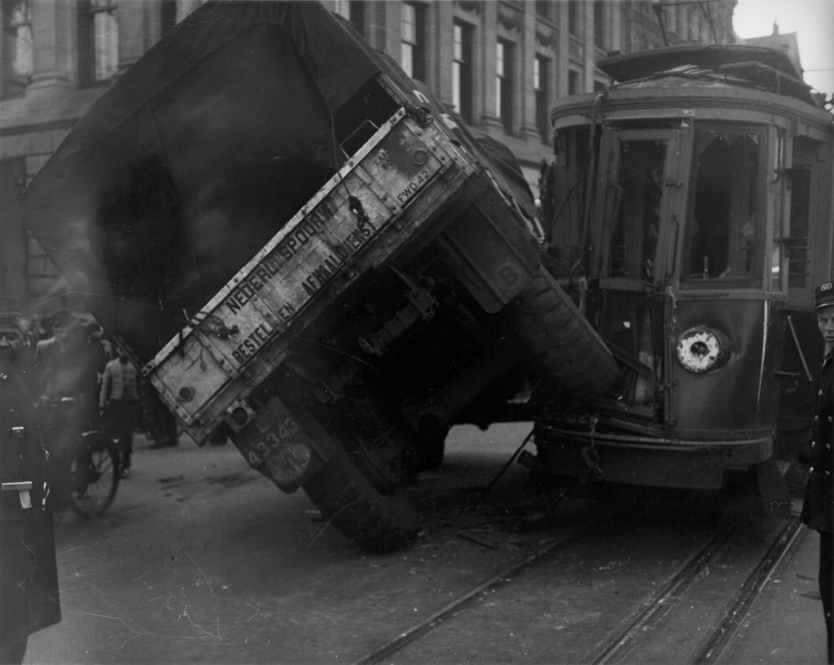 #3 Truck of the Dutch Railways hit the tram, half on its side, Raadhuisstraat, Amsterdam, April 14, 1947
