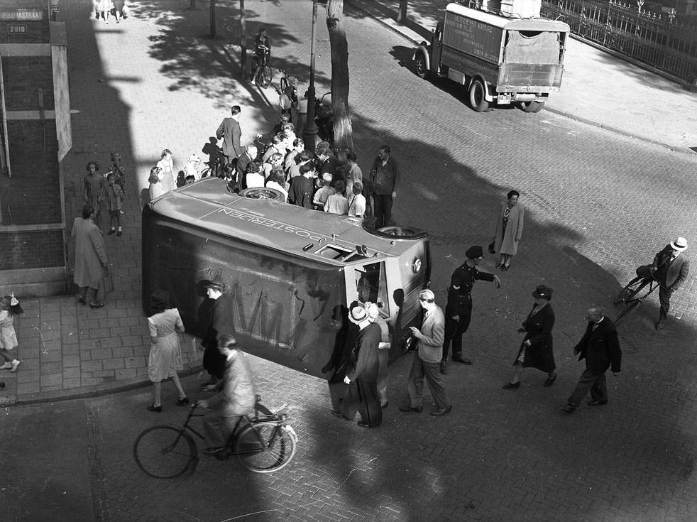 #7 Overturned car of the Post Office, Hobbemastraat corner Jan Luijkenstraat, Amsterdam, September 4, 1947