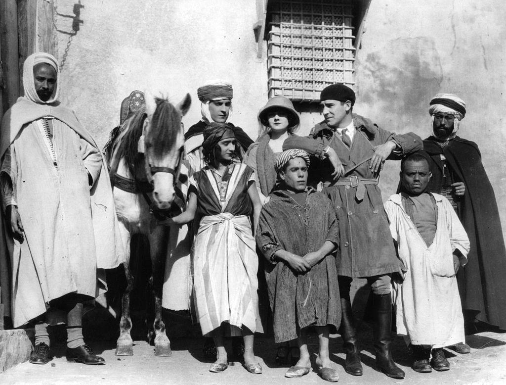 #23 Alice Terry with Rex Ingram, Ramon Novarro and a group of native actors during the filming of ‘The Arab’, 1924.