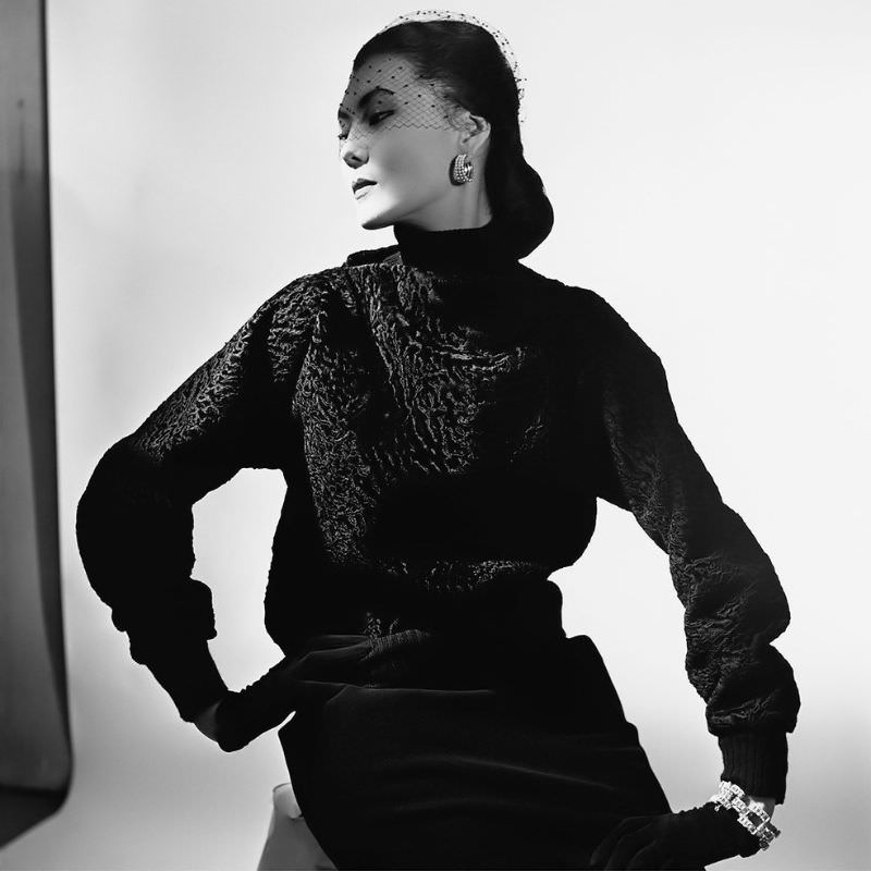 #10 Alla poses in a broadtail lamb pullover and skirt designed by Elsa Schiaparelli, 1949
