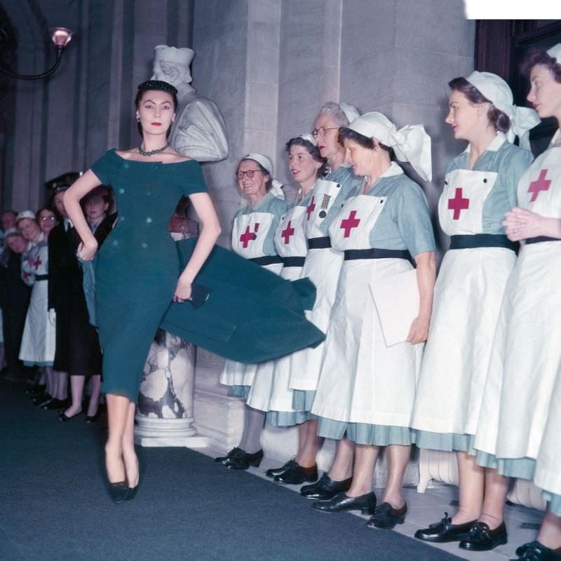 #25 Alla delights British Red Cross nurses in a creation by Christian Dior during the presentation of his Winter Collection at Blenheim Palace in aid of the British Red Cross, November 3, 1954