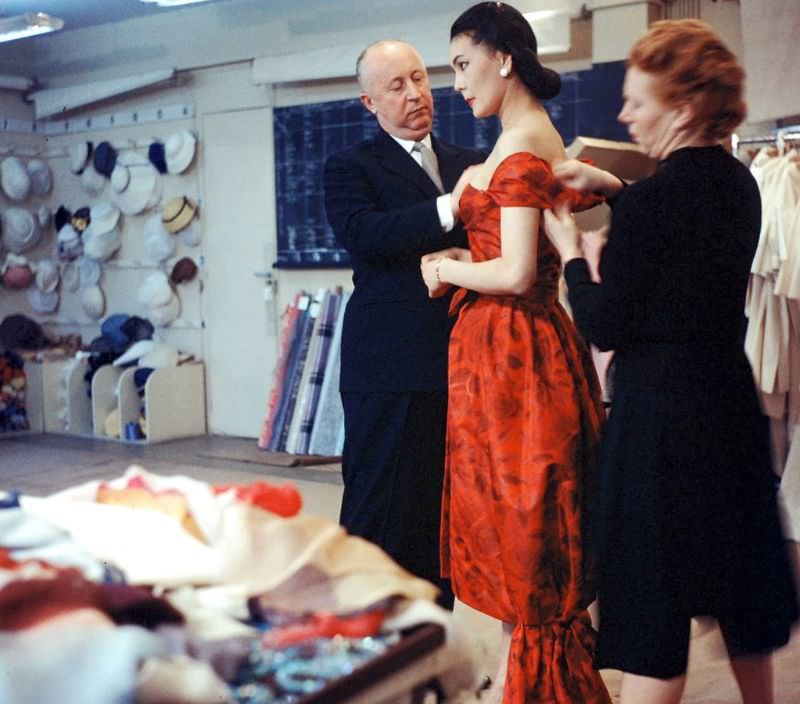 #32 Dior and his seamstress adjust gown on Alla, photo by Loomis Dean, Paris, 1957