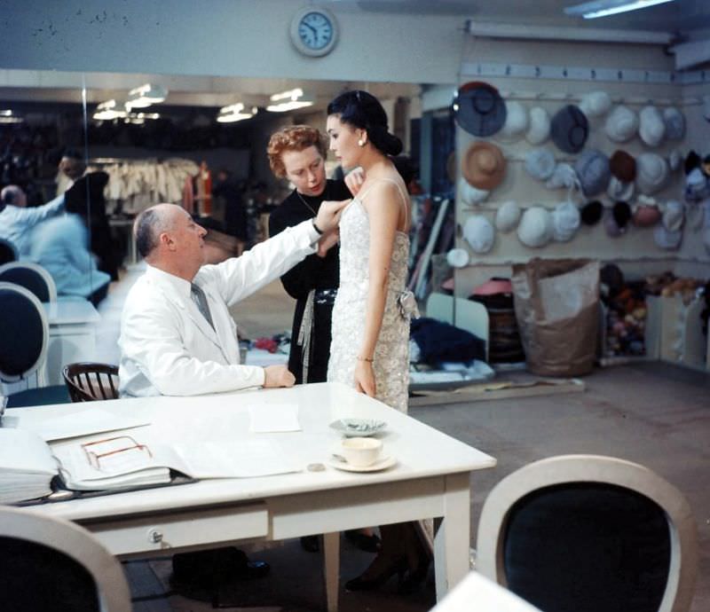 #33 Dior and his seamstress adjusting a gown on Alla, photo by Loomis Dean, Paris, 1957