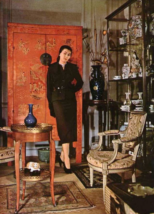 #7 Alla in wool suit, jacket is belted with double layered lapels, by Christian Dior, 1949