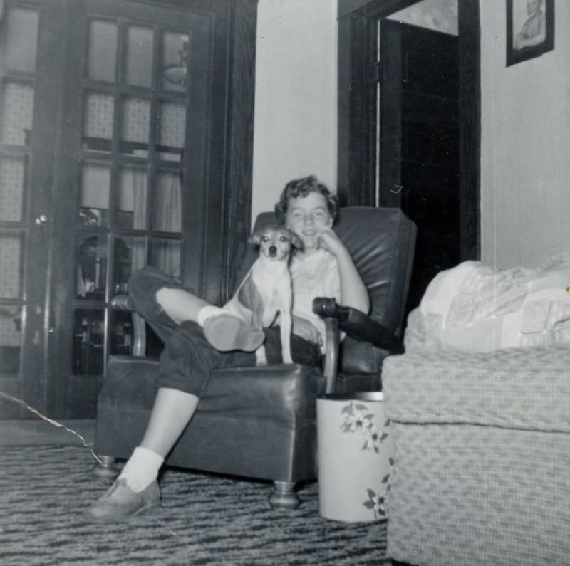 #11 Girl sitting in chair with dog