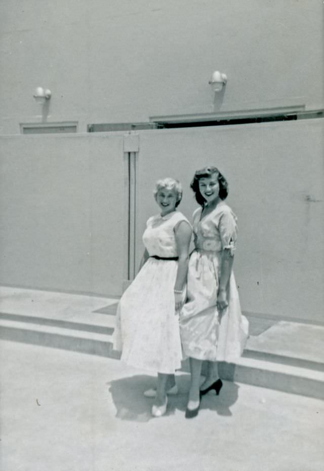 #30 Two girls in dresses pose