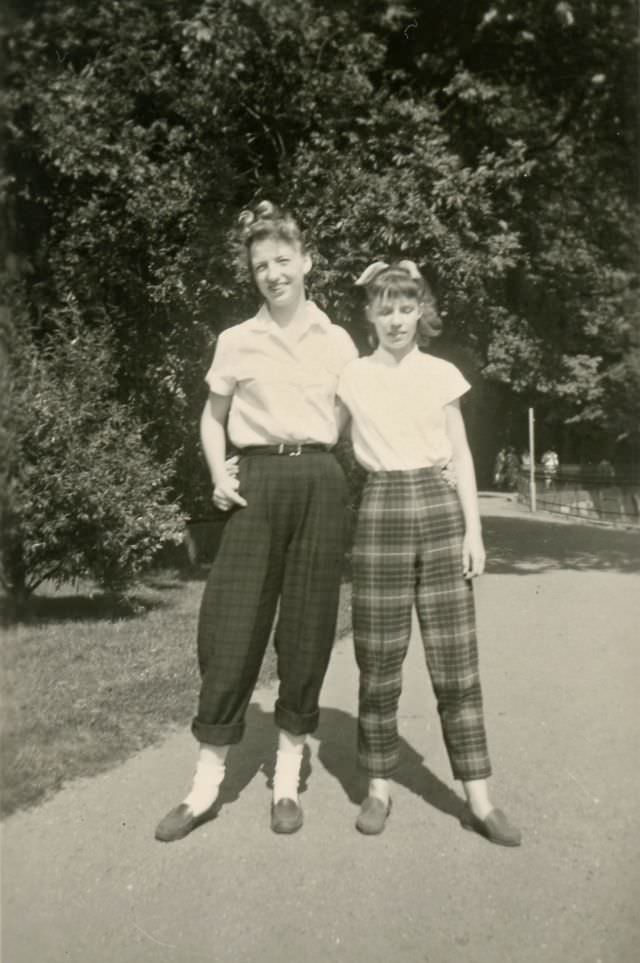 #31 Two girls pose in plaid slacks