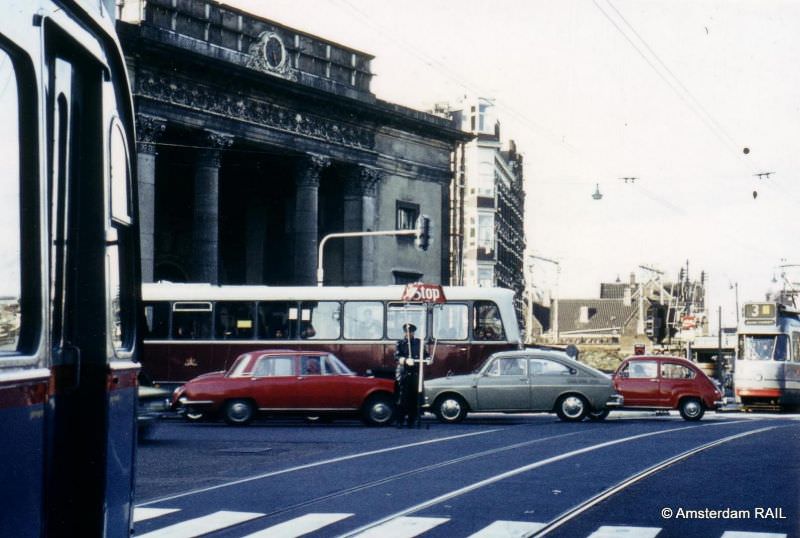 #33 The traffic police in control of cars during rush hour, Haarlemmerplein, Amsterdam, January 1973