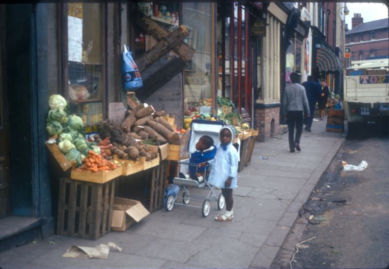 #22 Children outside Eastside Vegetable Shop on Longmore Street, Balsall Heath, 1968