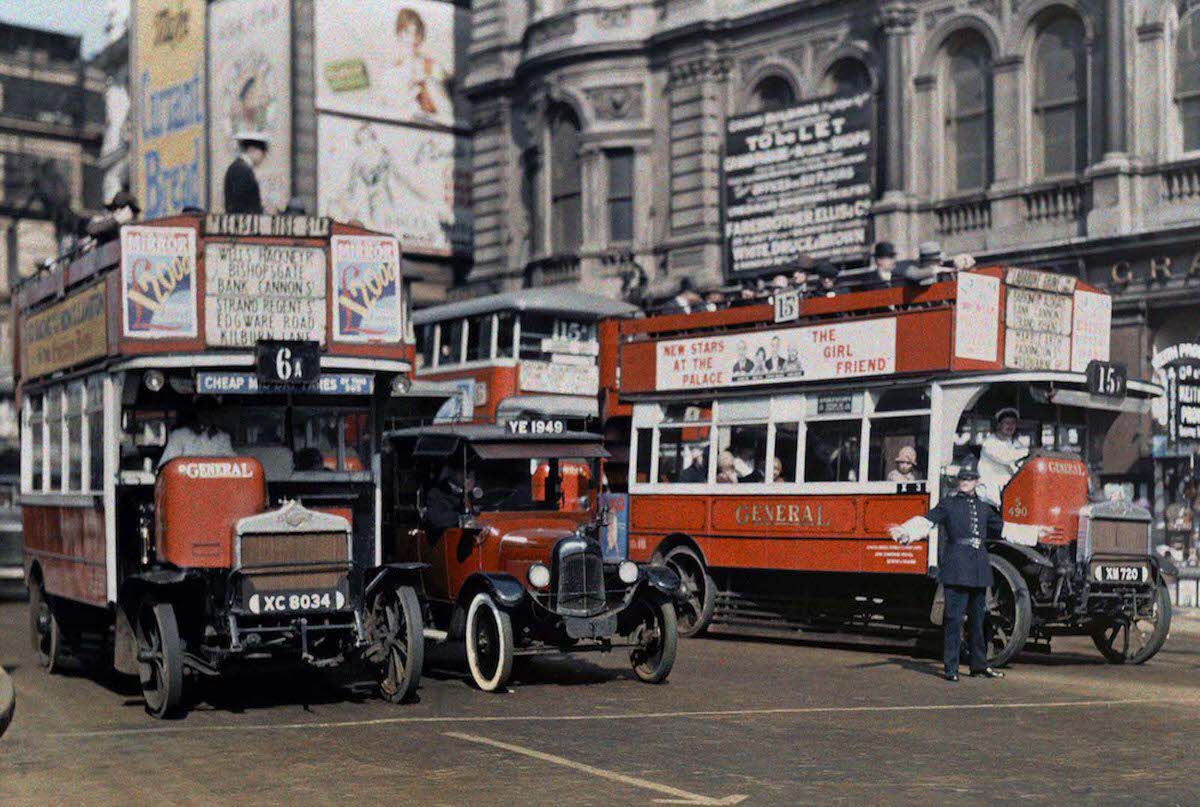 #1 A policeman directs buses in the intersection of Trafalgar Square, London.