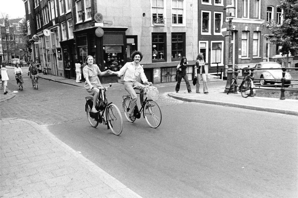 #1 Couple of cyclists on a street in central Amsterdam, 1950s.