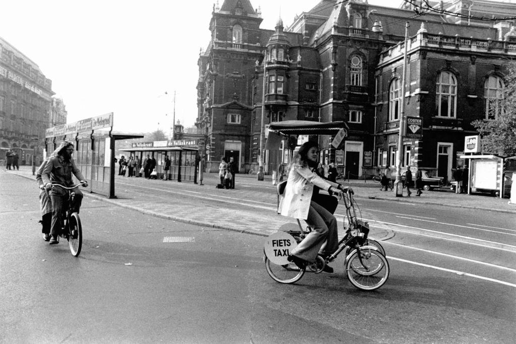 #17 Cyclist in an Amsterdam street deserted by cars, during fuel shortages caused by the first oil shock, 1973.