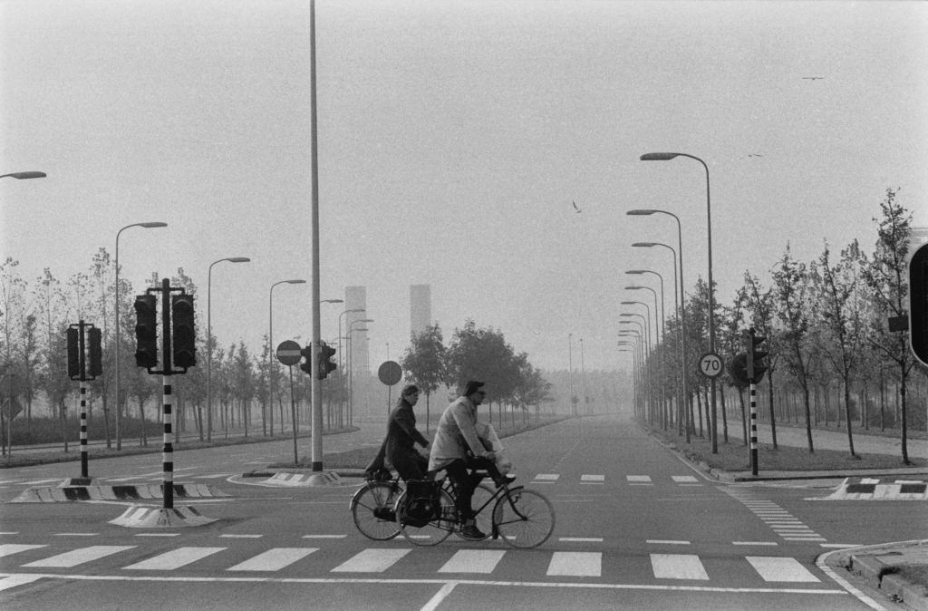 #18 Cyclist in an Amsterdam street deserted by cars, during fuel shortages, 1973.
