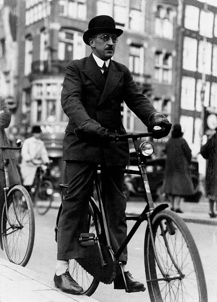 #9 Cyclist with special hand warmers on a bike in the city Vintage property of ullstein bild in Amsterdam, 1930s.