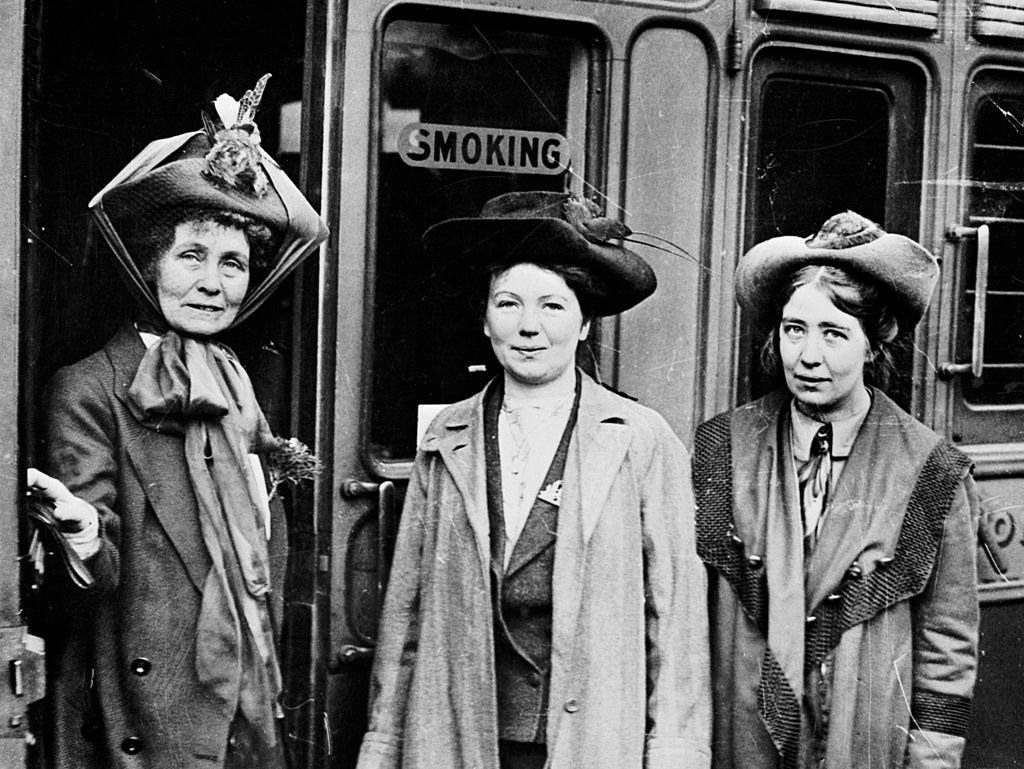 #41 Emmeline, Christabel and Sylvia Pankhurst, Waterloo Station, London, 1911.