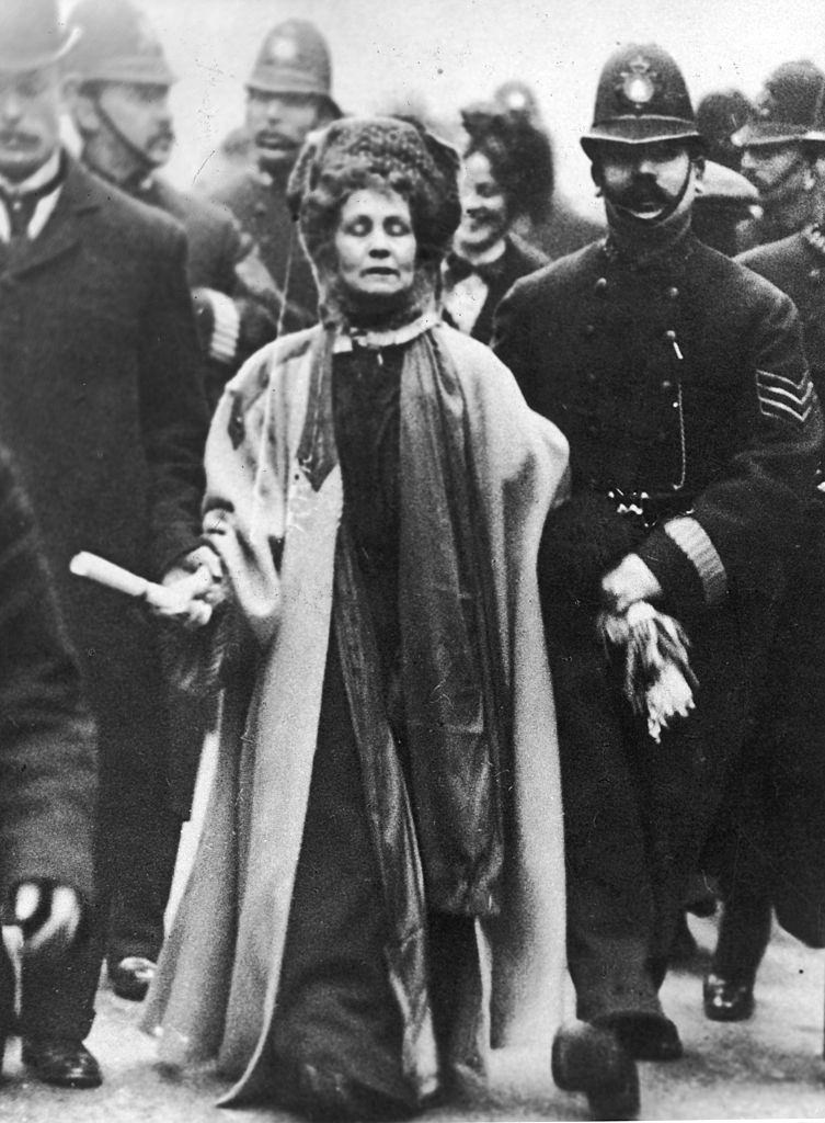 #5 Emmeline Pankhurst surrounded by police officers, 1900.