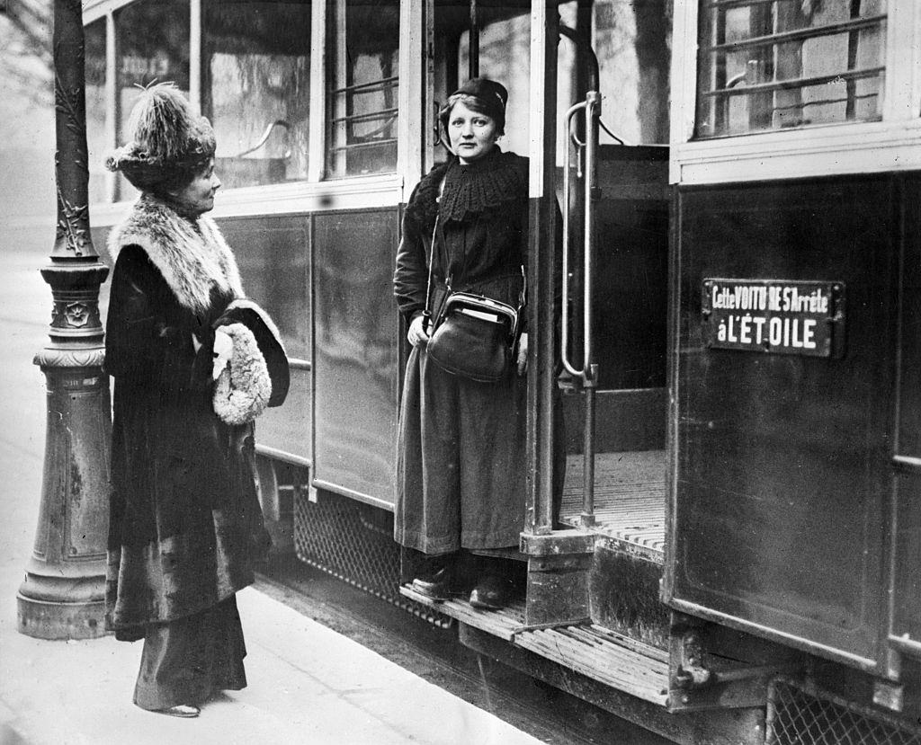 #60 Emmeline Pankhurst talking to one of the women street car conductors.