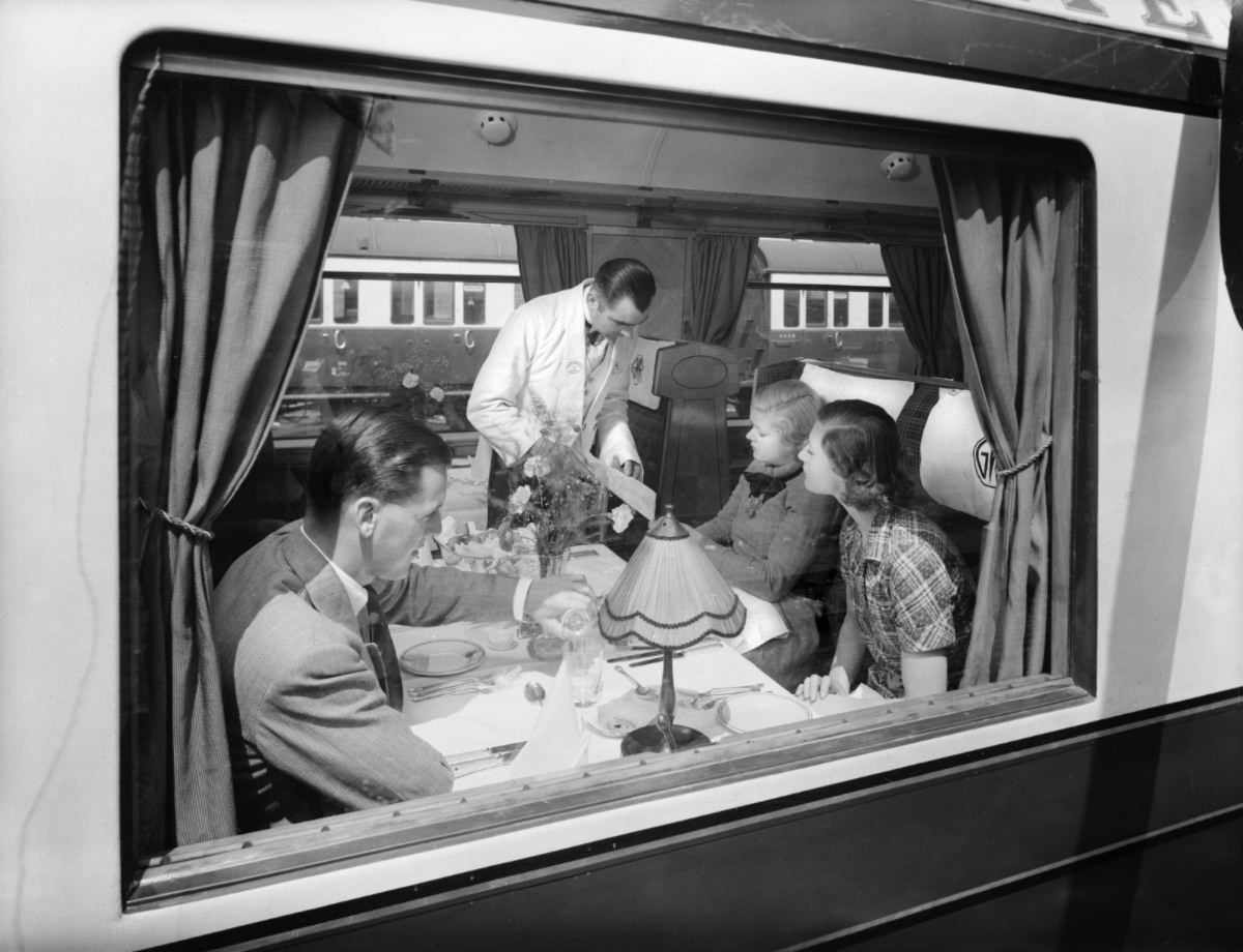 #3 Passengers in a first class Great Western Railway dining car.