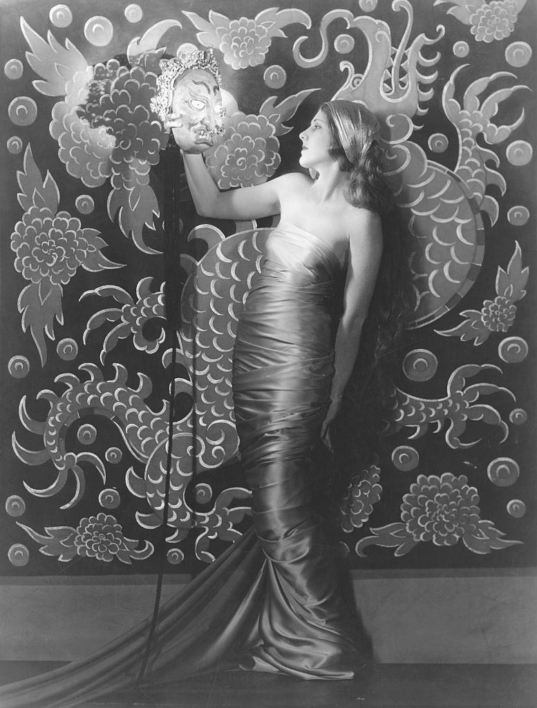 #10 Jean Arthur holding an asian style mask, 1930.