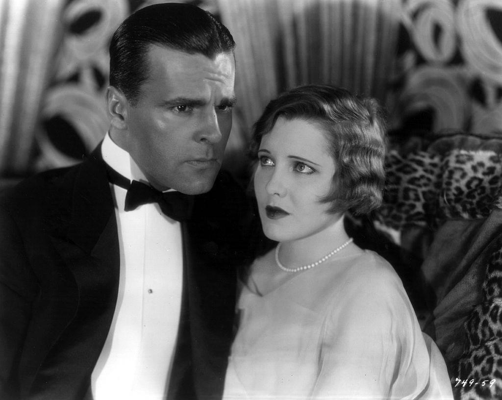#19 Jean Arthur with Neil Hamilton in a tense moment from the film ‘The Insidious Dr Fu Manchu’, 1931.