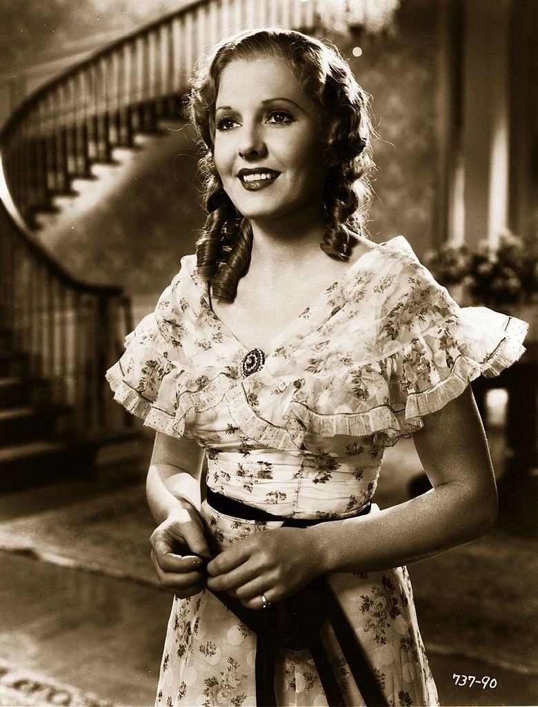 #27 Jean Arthur plays Emma in a scene from ‘Diamond Jim’, 1935.