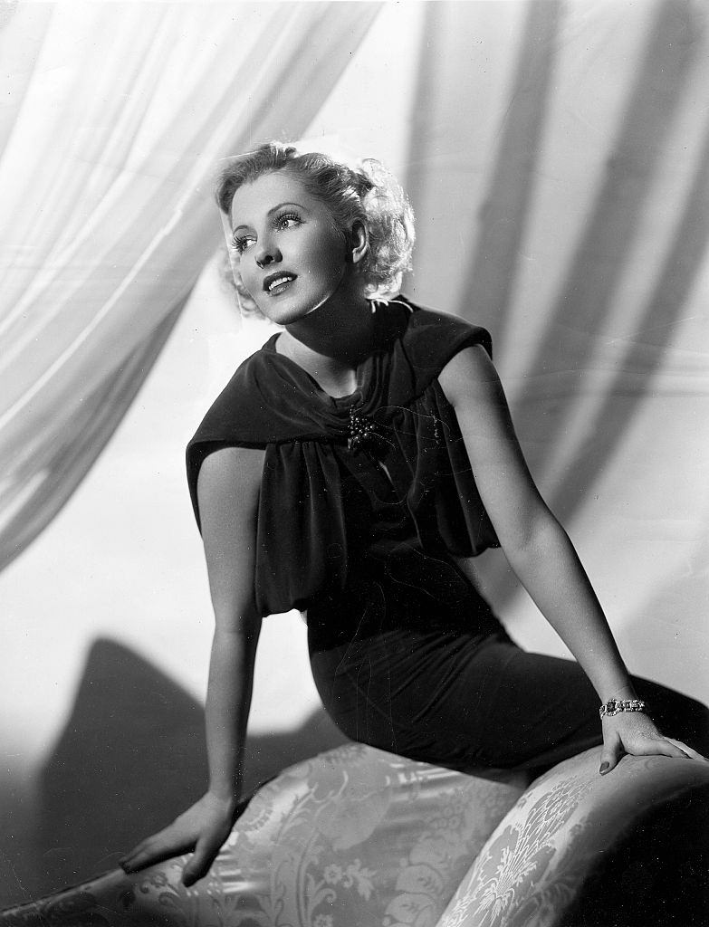 #35 Jean Arthur sitting on the sofa, 1937.